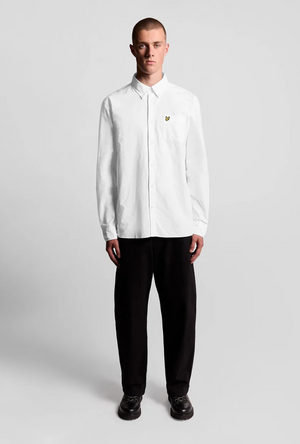 Front image of a model wearing the Lyle and scott plain oxford shirt in white, by brand Lyle and scott