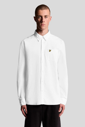 Front image of a model wearing the Lyle and scott plain oxford shirt in white, by brand Lyle and scott