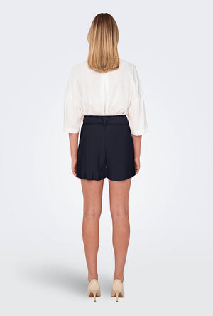 Back image of a model wearing the Only nova life talia shorts in navy, by brand Only