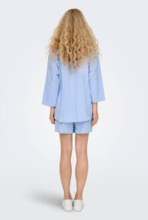 Back image of a model wearing the Augusta s/s shirt in light blue, by brand Only