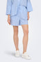 Front image of a model wearing Augusta shorts in light blue, by brand Only