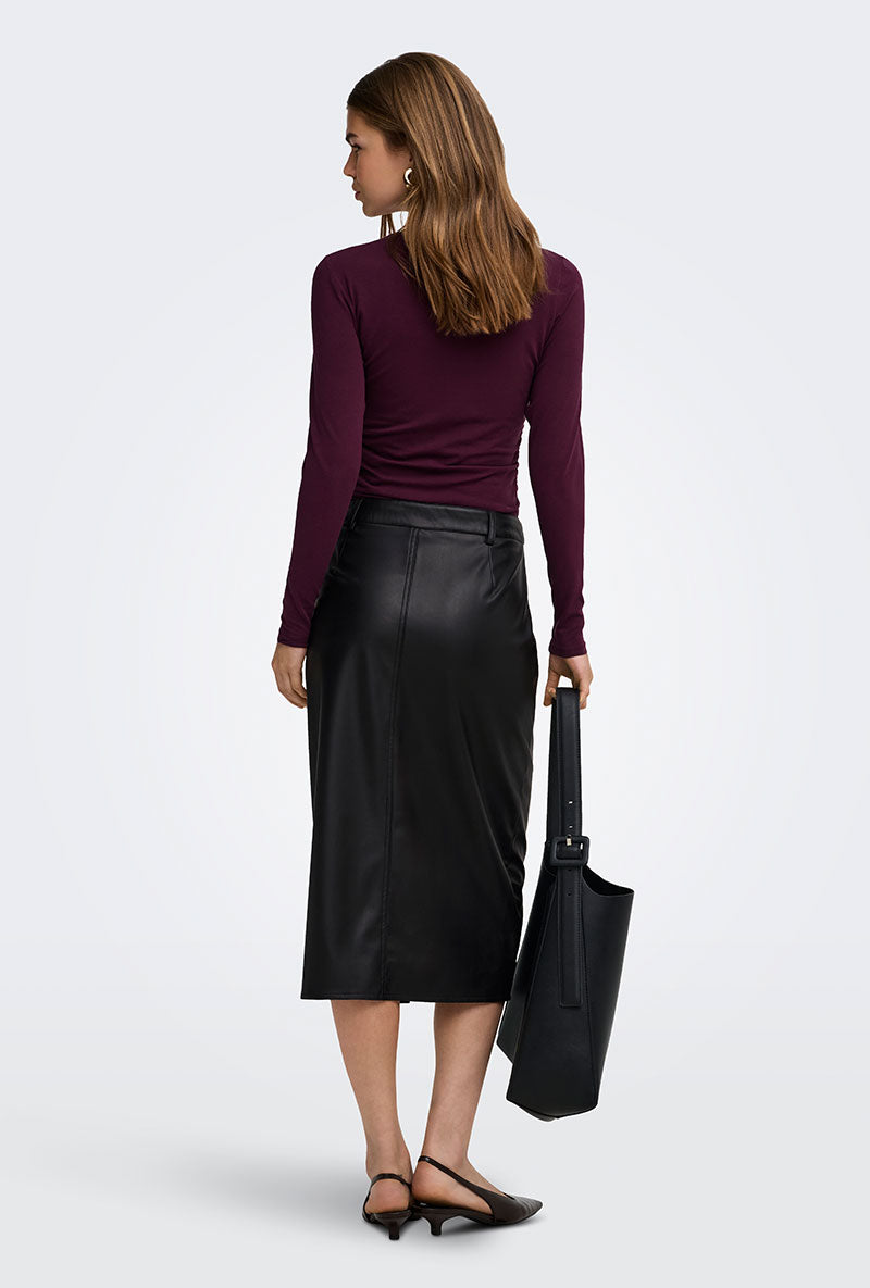 Back image of a model wearing Bitten faux leather pencil skirt in black, by brand Only