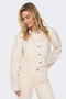 Front image of a model wearing the Only elsa crochet short jacket in off white, by brand Only