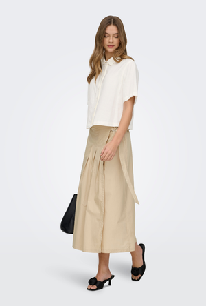Front image of a model wearing the Goa shortsleeve linen shirt in off white, by brand Only