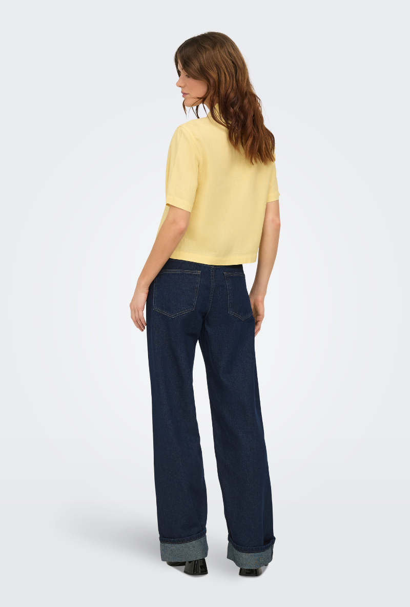 Back image of a model wearing Goa shortsleeve linen shirt in yellow, by brand Only