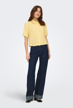 Front image of a model wearing the Goa shortsleeve linen shirt in yellow, by brand Only