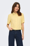 Front image of a model wearing the Goa shortsleeve linen shirt in yellow, by brand Only