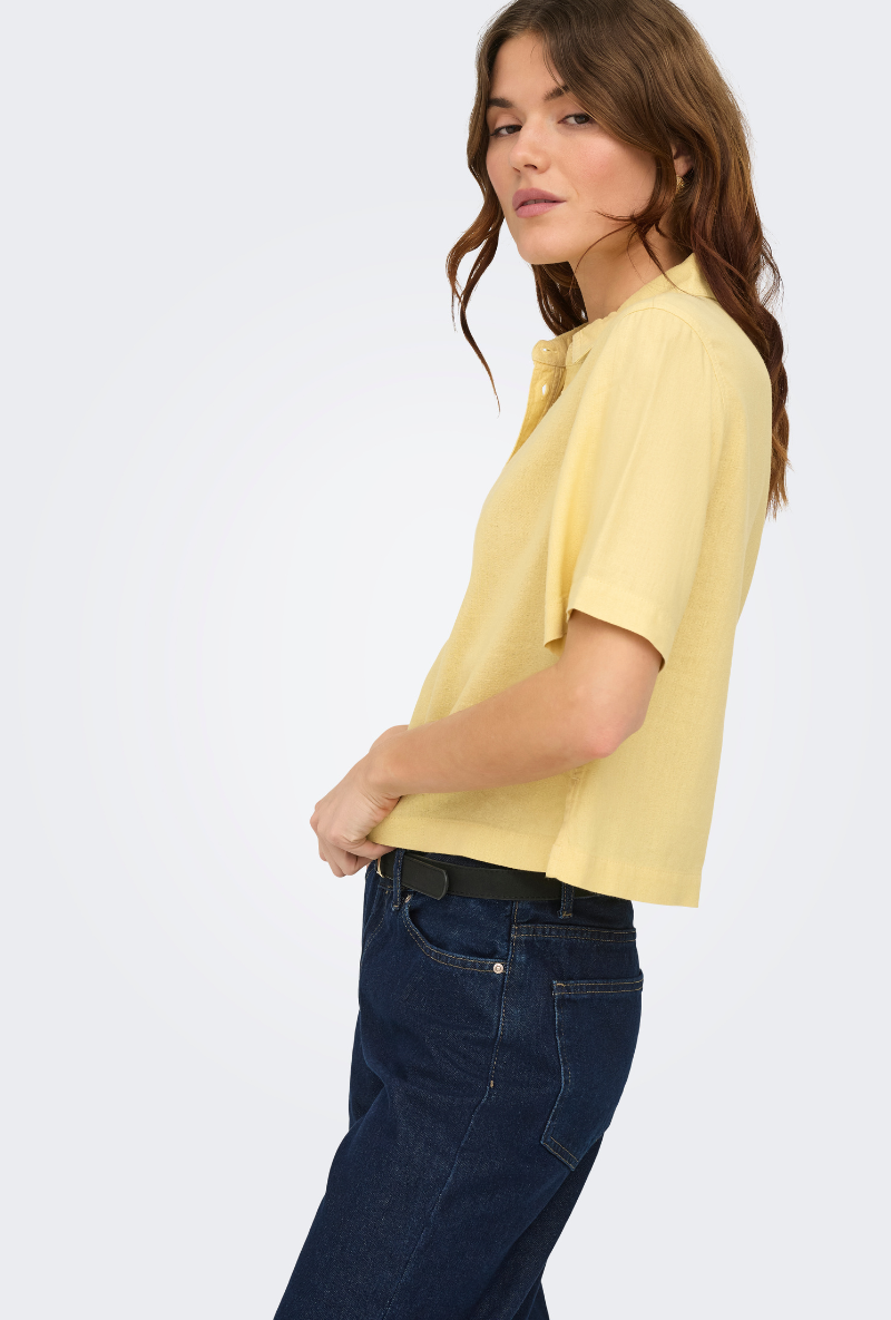 Front detail image of a model wearing Goa shortsleeve linen shirt in yellow, by brand Only