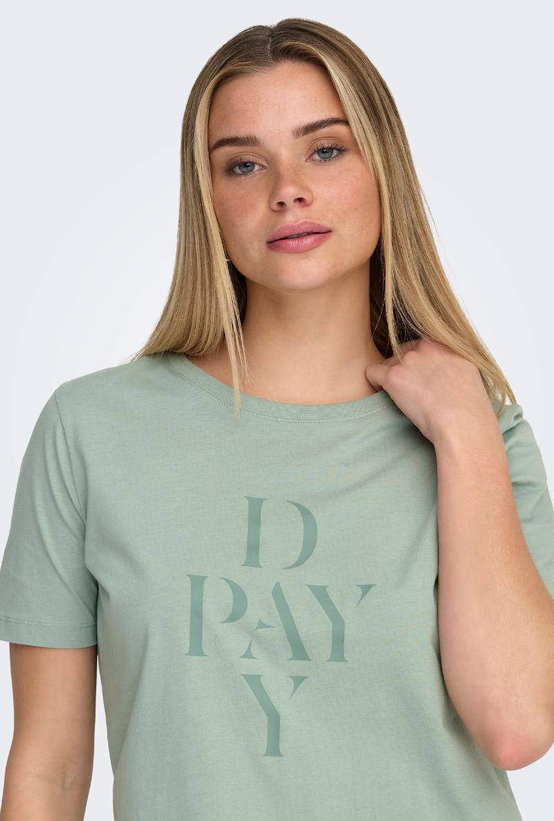 Front image of a model wearing Only happy s/s print top in sage, by brand Only