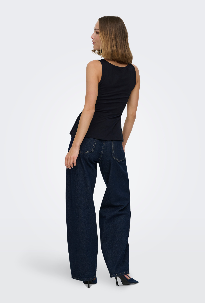 Back image of a model wearing Kiss sleeveless peplum top in black, by brand Only