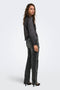 Back image of a model wearing the Lindona l/s satin lace shirt in black, by brand Only
