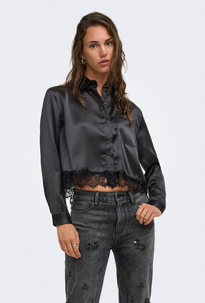 Front image of a model wearing Lindona l/s satin lace shirt in black, by brand Only