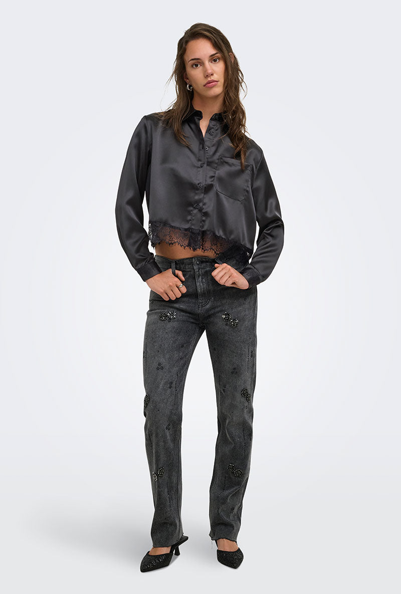 Front image of a model wearing Lindona l/s satin lace shirt in black, by brand Only