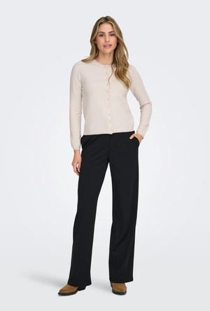 Front image of a model wearing the Only loyal oneck button cardi in beige, by brand Only