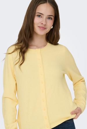Front image of a model wearing the Only loyal oneck button cardi in yellow, by brand Only