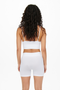 Back image of a model wearing the Only vicky seamless short in white, by brand Only