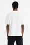 Back image of a model wearing the Initial oversized t in off white, by brand Represent