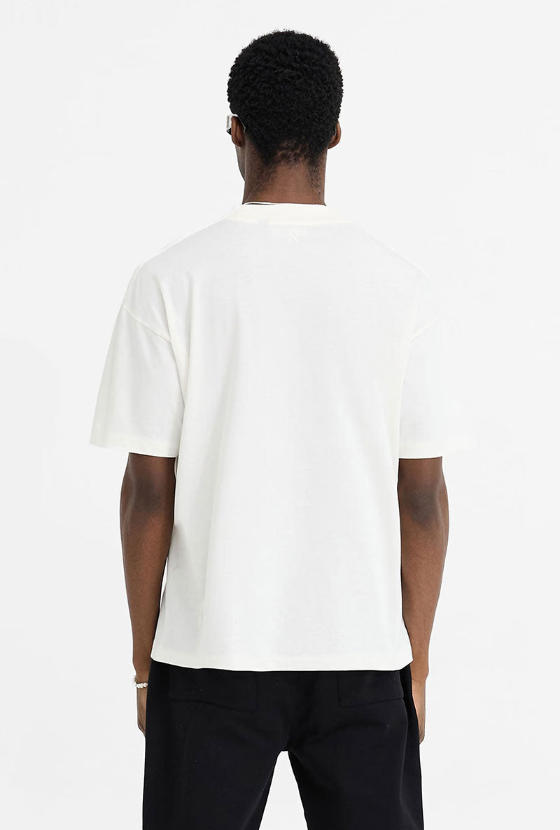 Back image of a model wearing Initial oversized t in off white, by brand Represent