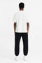 Back image of a model wearing the Initial oversized t in off white, by brand Represent