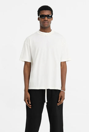 Front image of a model wearing Initial oversized t in off white, by brand Represent