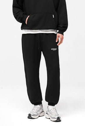 Front image of a model wearing Owners club sweatpant in black, by brand Represent