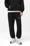 Front image of a model wearing Owners club sweatpant in black, by brand Represent