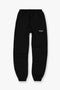 Front image of a model wearing the Owners club sweatpant in black, by brand Represent