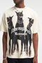 Front image of a model wearing the Thoroughbread t in off white, by brand Represent