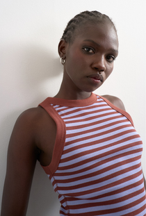 Front image of a model wearing the Sanne rib racer vest in chocolate, by brand Top shop