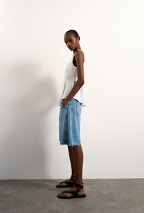 Front image of the Mariam sleeveless curve hem top in white, by brand Top shop