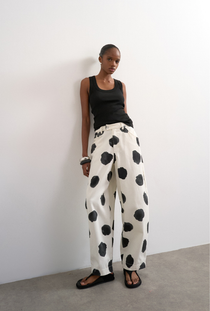 Front image of the Yara highrise dot barrel trousers in white, by brand Top shop