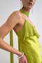Front detail image of a model wearing the Annika ruffle maxi dress in green, by brand Top shop