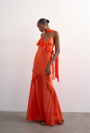 Front image of a model wearing Annika ruffle maxi dress in rust, by brand Top shop
