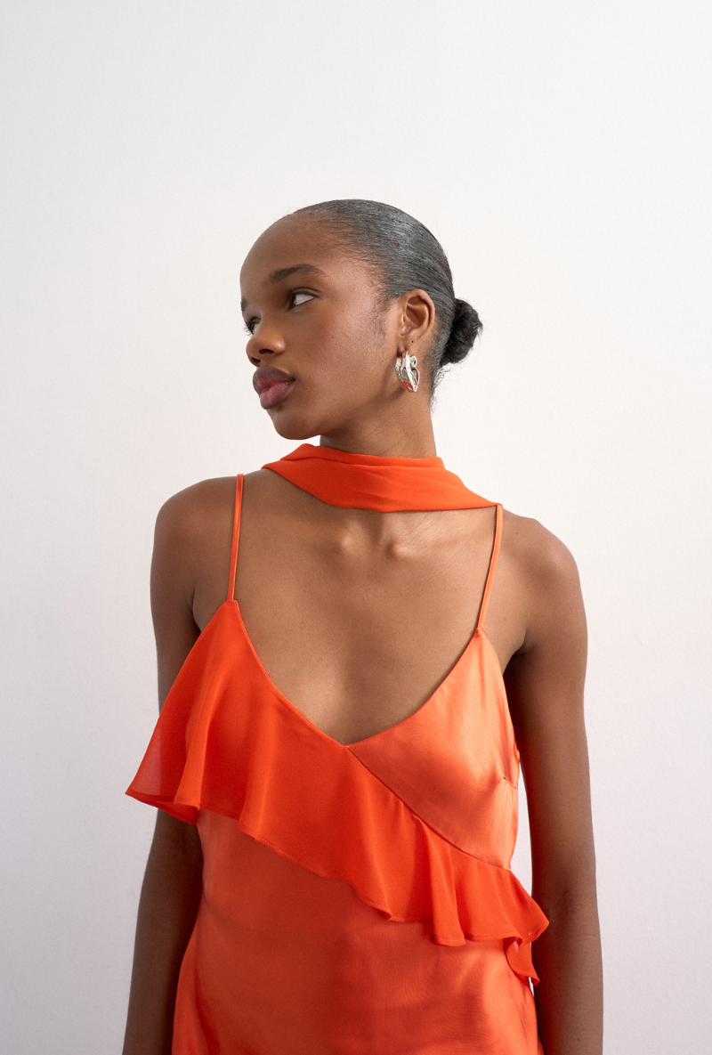 Front image of a model wearing Annika ruffle maxi dress in rust, by brand Top shop
