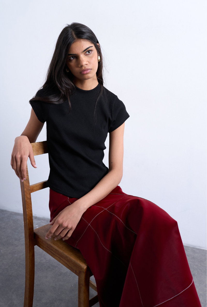 Front image of a model wearing Bea oneck fitted rib tee in black, by brand Top shop