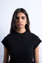 Front image of a model wearing the Bea oneck fitted rib tee in black, by brand Top shop