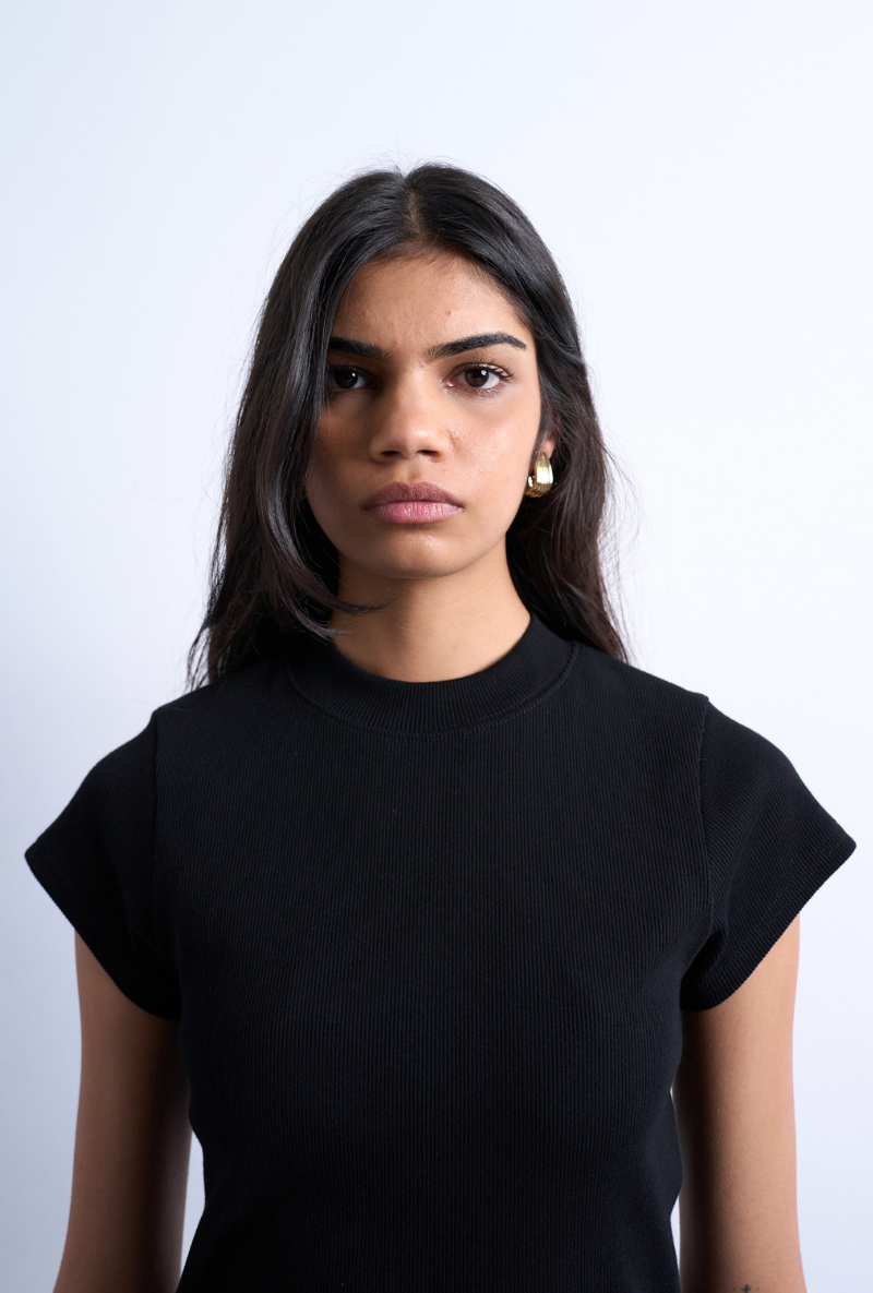 Front image of a model wearing Bea oneck fitted rib tee in black, by brand Top shop