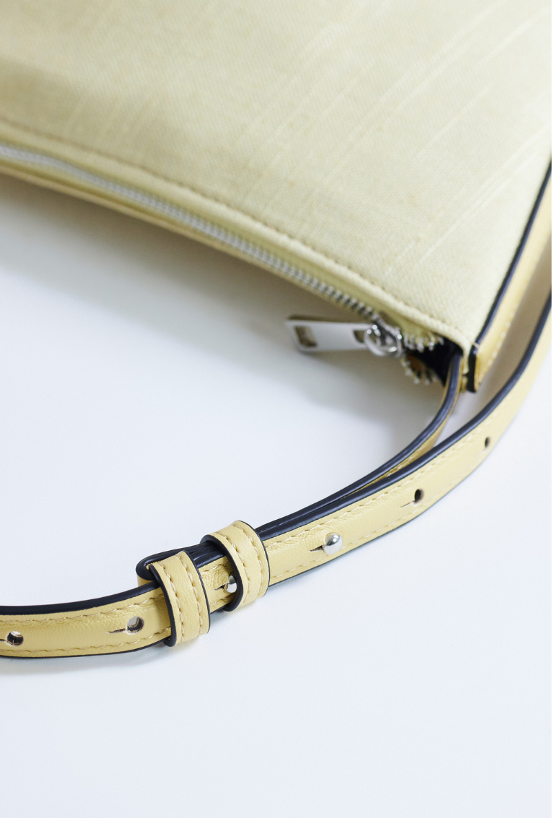 Front detail image  of Curly canvas scoop shoulder bag in lemon, by brand Top shop