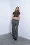 Front image of a model wearing Everyday crop top in chocolate, by brand Top shop