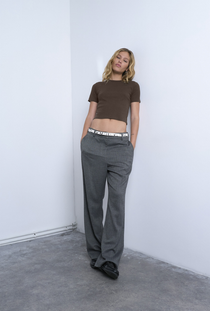 Front image of a model wearing the Everyday crop top in chocolate, by brand Top shop
