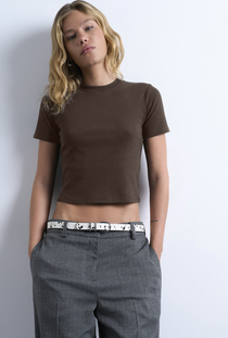 Front image of a model wearing the Everyday crop top in chocolate, by brand Top shop