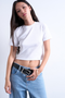 Front image of a model wearing the Everyday crop top in white, by brand Top shop