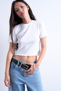 Front image of a model wearing the Everyday crop top in white, by brand Top shop