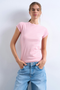 Front image of a model wearing the Everyday top in pink, by brand Top shop