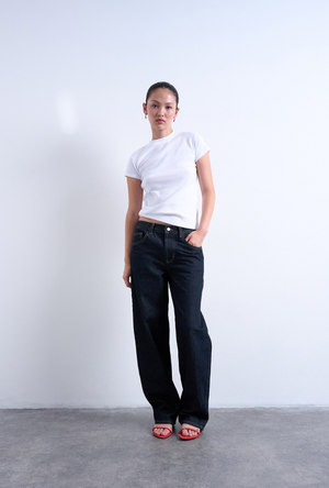Front image of a model wearing the Everyday top in white, by brand Top shop