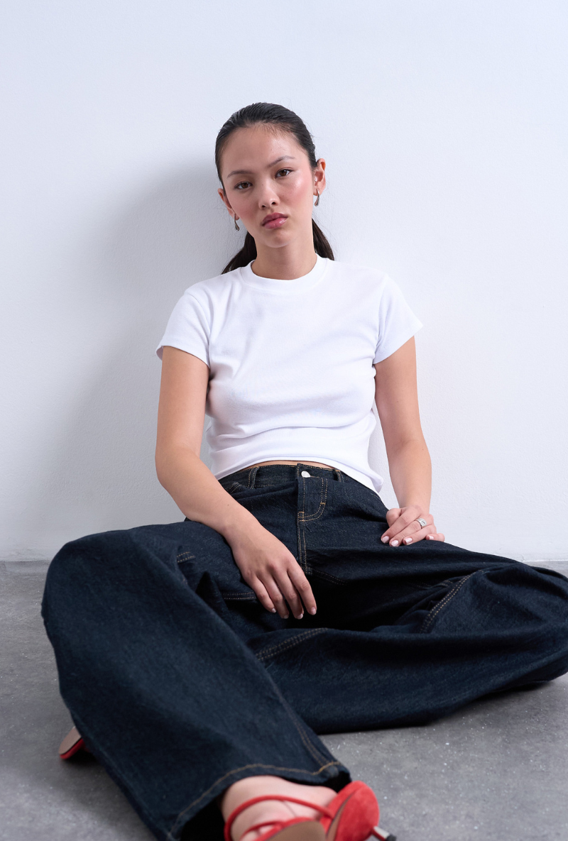 Front image of a model wearing Everyday top in white, by brand Top shop