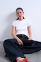 Front image of a model wearing the Everyday top in white, by brand Top shop