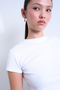 Front detail image of a model wearing the Everyday top in white, by brand Top shop