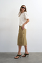 Front image of a model wearing the Femke longline cargo shorts in tan, by brand Top shop