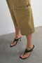 Front detail image of a model wearing the Femke longline cargo shorts in tan, by brand Top shop